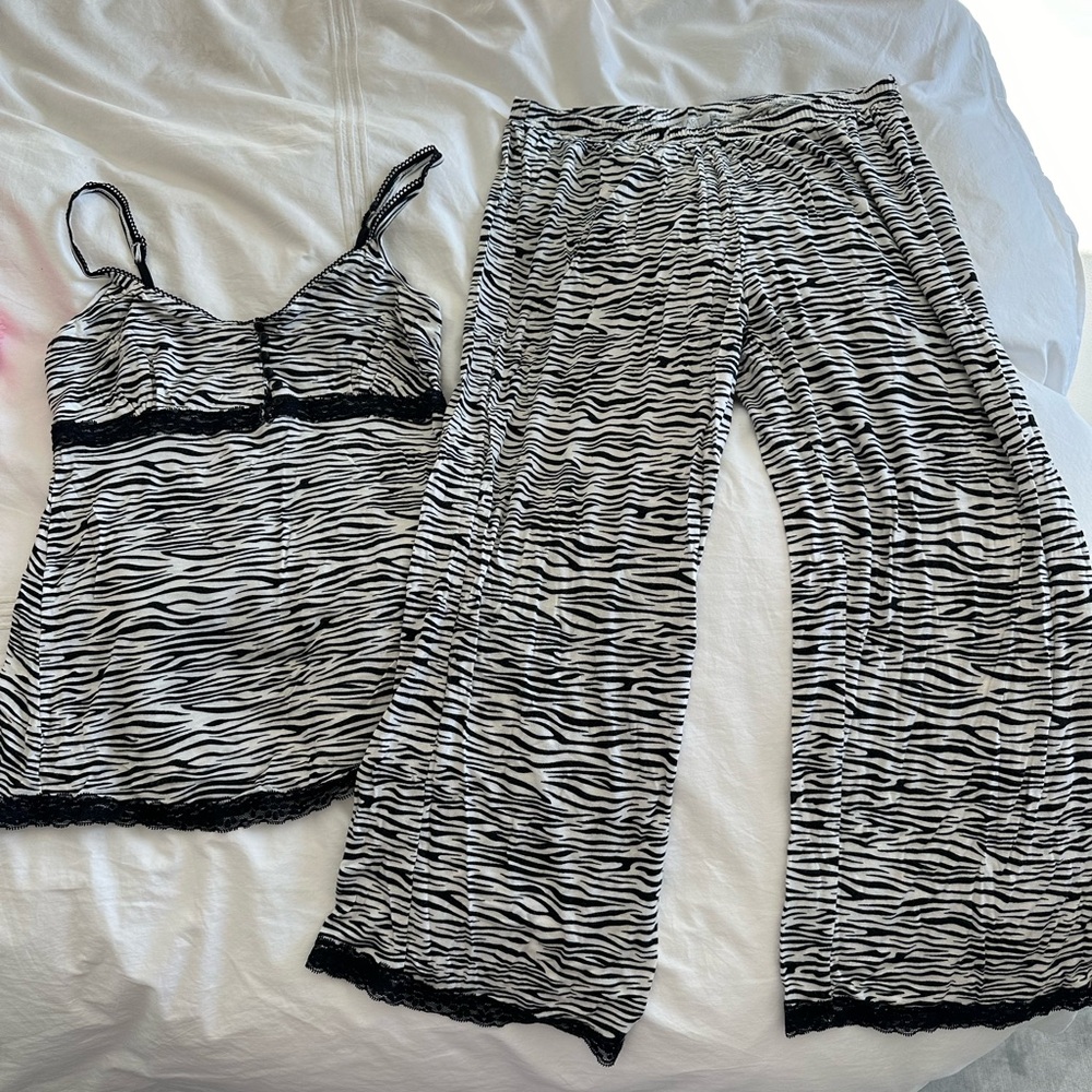 Soft, sexy pajama set by Tart, size M. Zebra print, keyhole buttons, lace trim.